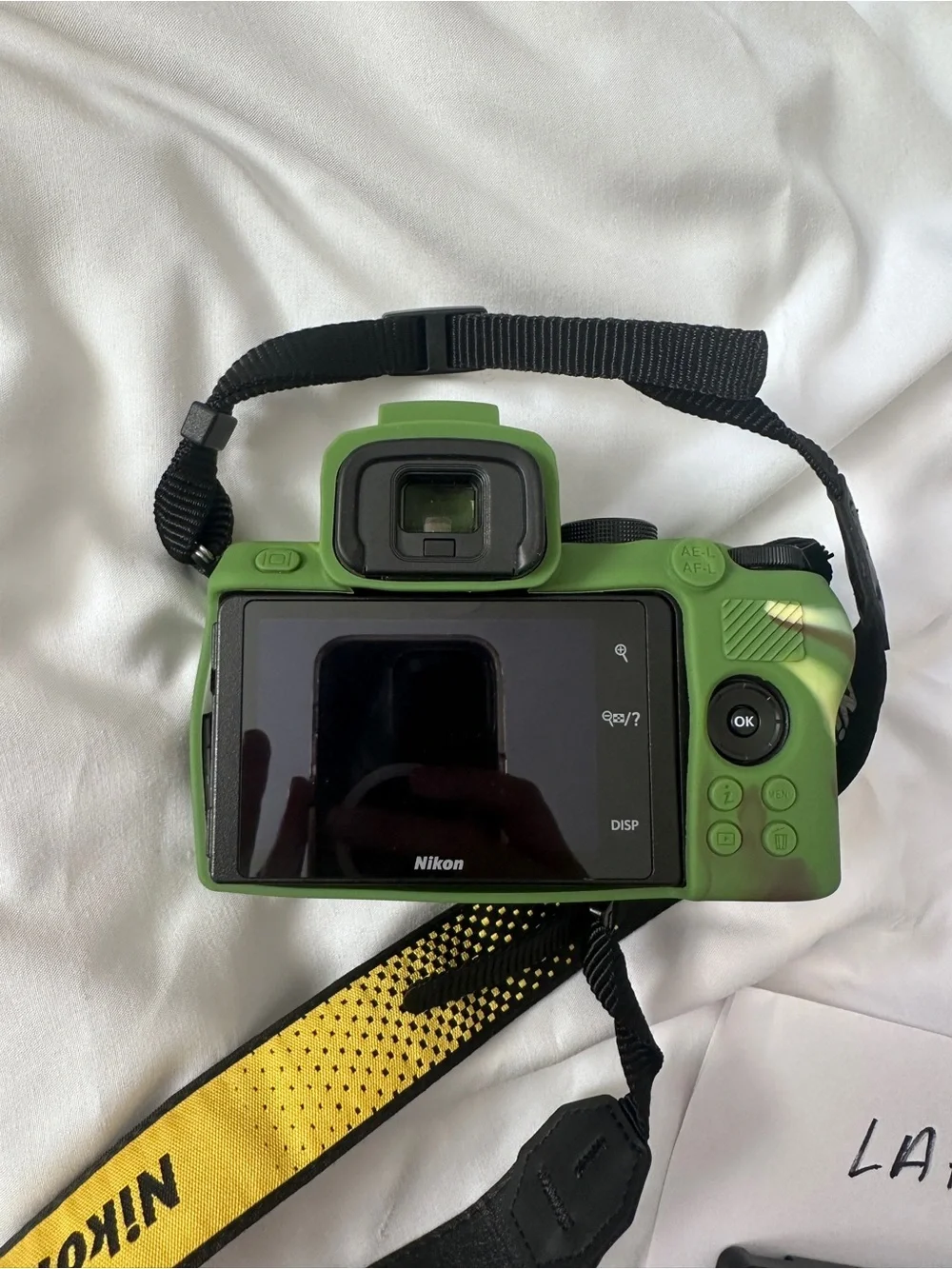 Nikon Digital Camera Body with Green Camo Skin and Yellow Nikon Strap